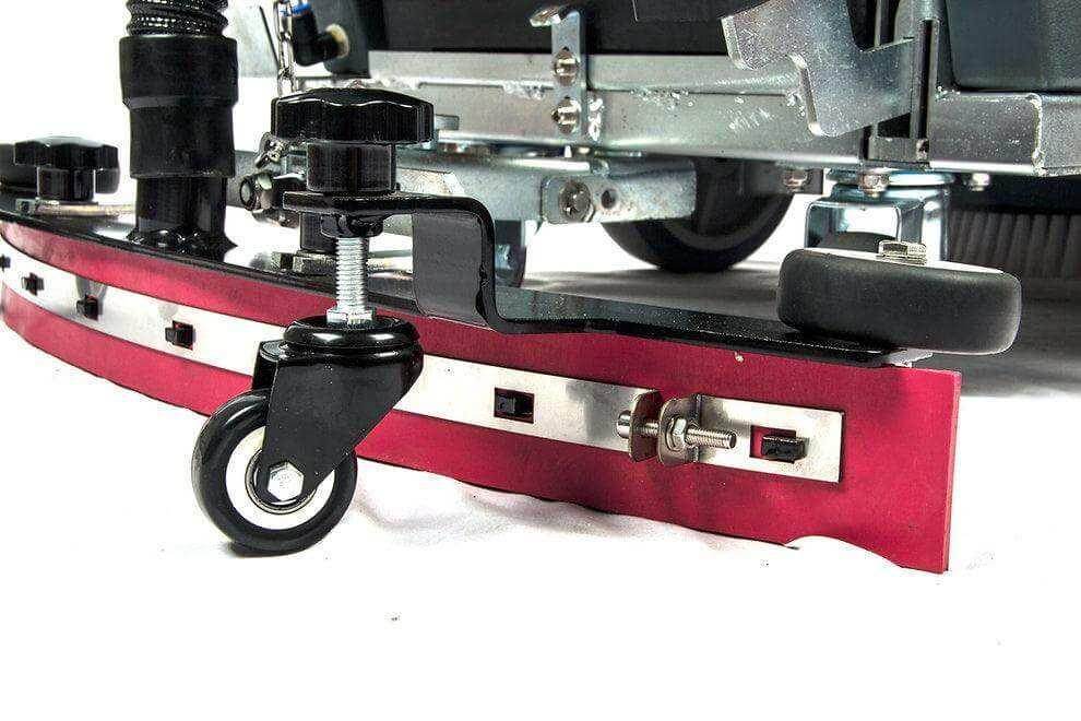 Close-up of the 22-inch brush and caster wheel on RT50 battery powered walk-behind floor scrubber for commercial cleaning.