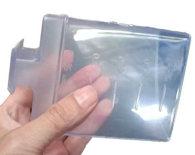 Transparent chemical-resistant measure cup for solution tank of SUNMAX RT50 and RT70 floor scrubbers with clear volume markings and ergonomic grip
