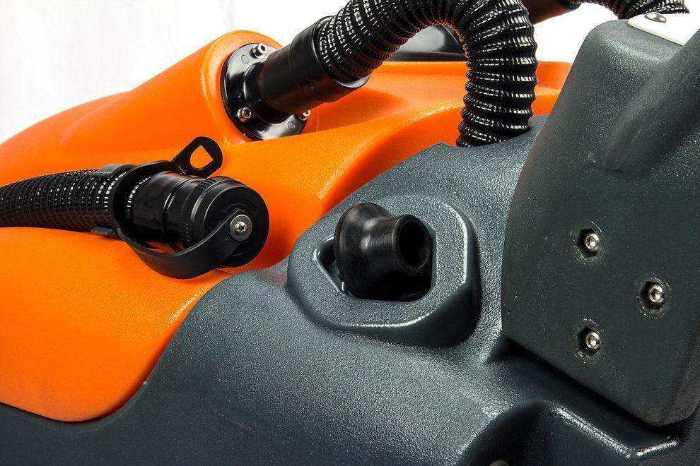 Close-up of 22-inch brush scrubbing path on RT50+ lithium battery-powered floor scrubber machine in orange and gray.