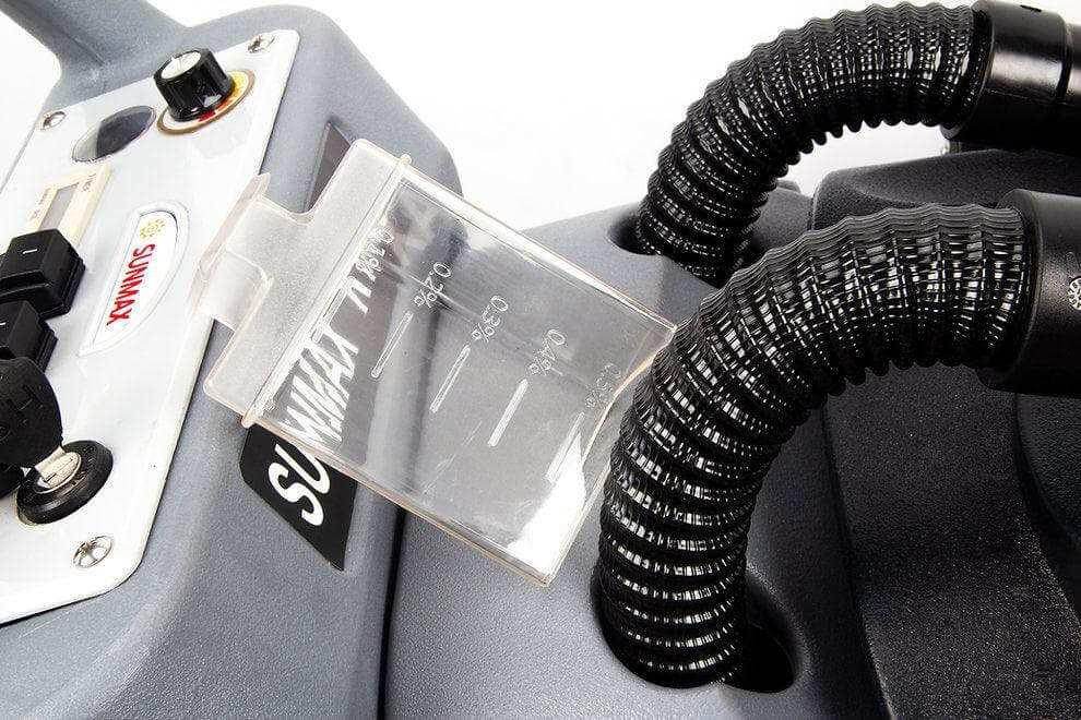 Close-up of RT50 battery powered walk-behind floor scrubber control panel and hose connections