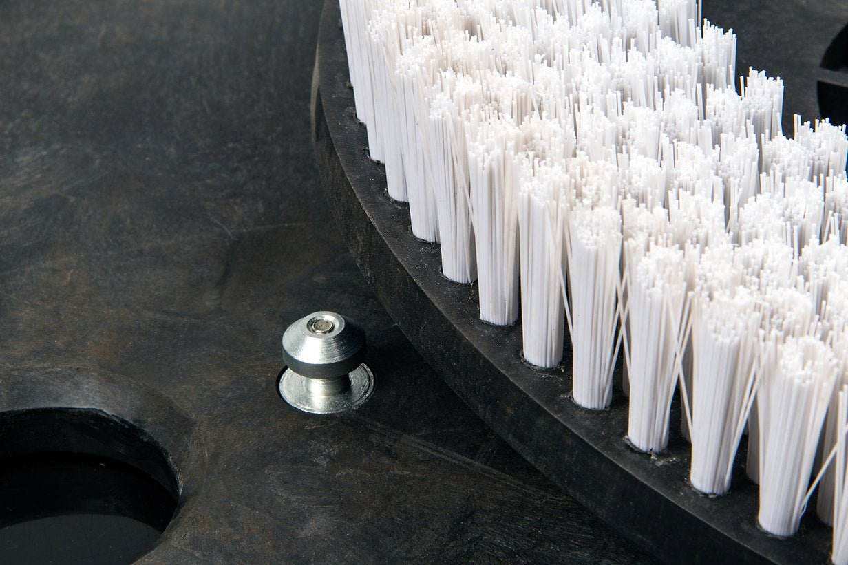 Close-up of white disk scrub brush bristles for SUNMAX RT120 floor scrubber machine